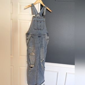 Light wash distressed denim overalls